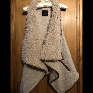 Faux Fur/shearling vest.  Brand new never worn!